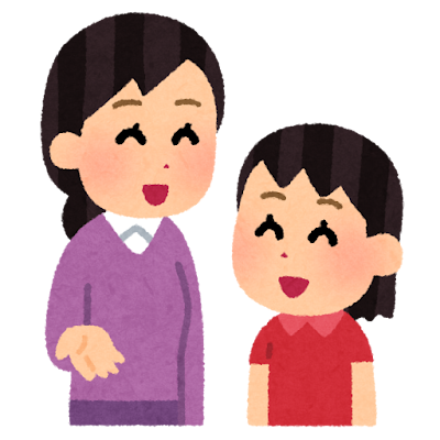子どもと大人がテーブルに向かい合って何かを書いたり話したりしている様子。スタッフと保護者でも可。見下ろす構図にならないよう、同じ目線で撮影したもの。